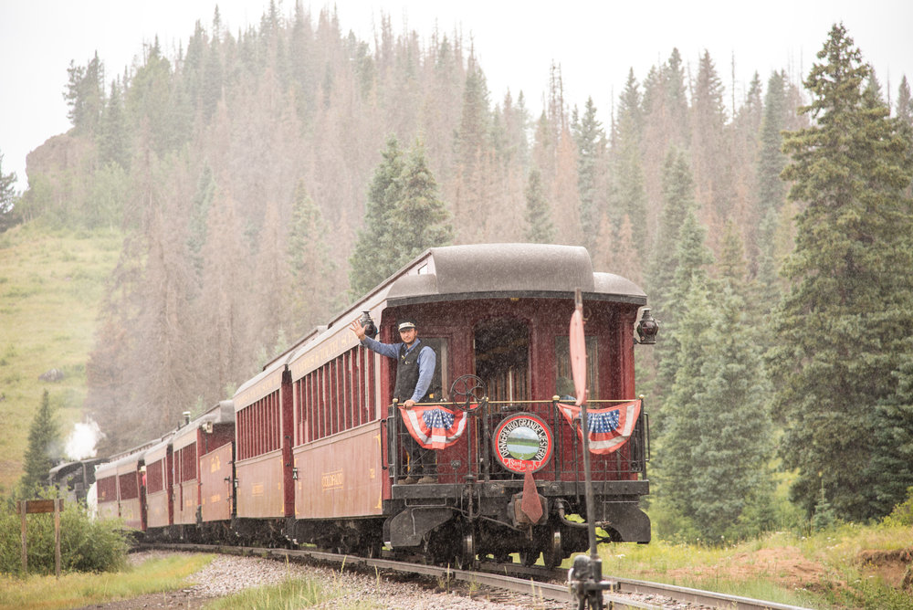 50 The parlor Colorado has just crested the summit as the trainman gives a friendly wave.jpg