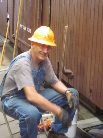 Bill McCall is replacing deteriorated siding on the Concession car..jpg