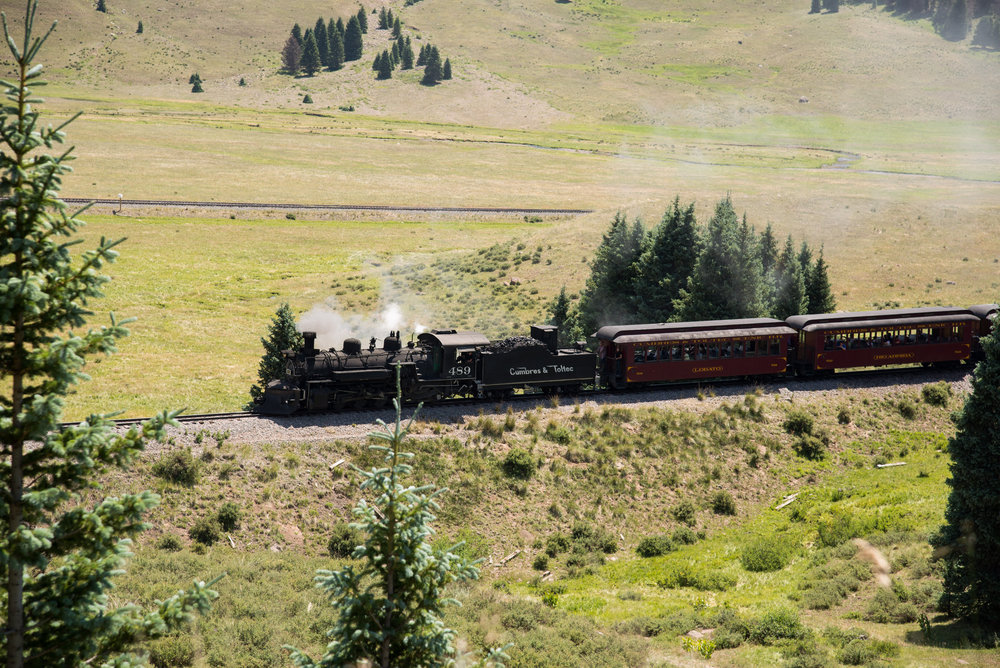 15 Train 216 is now drifting down grade into the Los Pinos valley.jpg