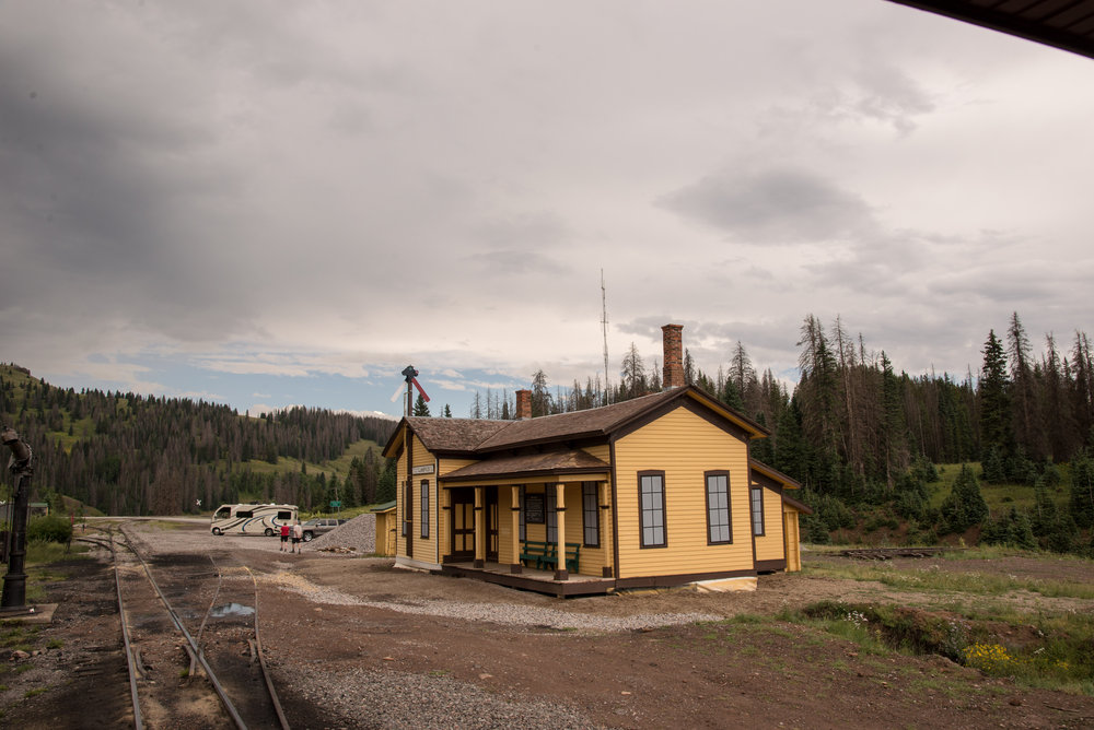 38 As train 215 departs Cumbres we see the west side of the section house.jpg