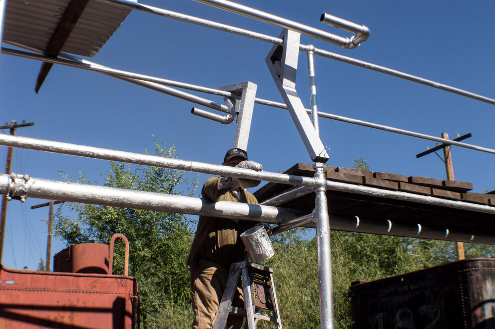 14 Painting the Gramps Oil loading rack tubing with a paint mit.jpg