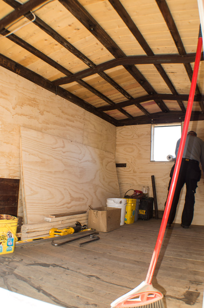 3 Applying the plywood sheathing to the inside of the new kitchen storage car.jpg