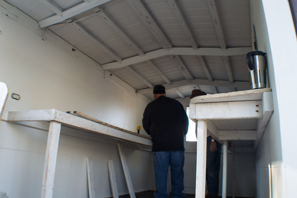18 The shelving is now being installed into the new kitchen storage car.jpg
