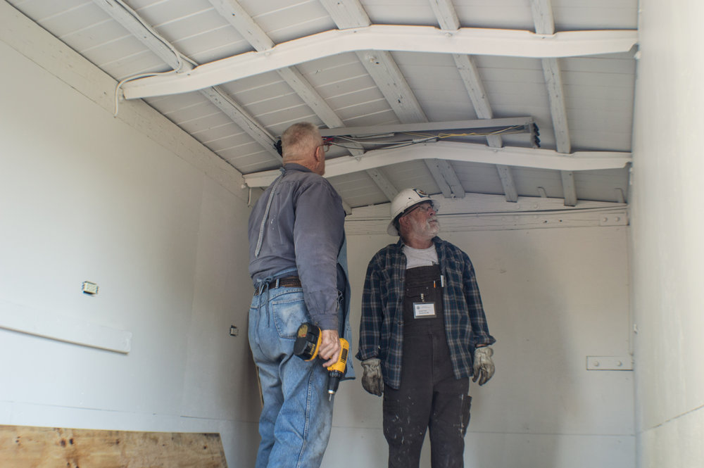 19 Hanging the light fixtures in the new kitchen storage car.jpg