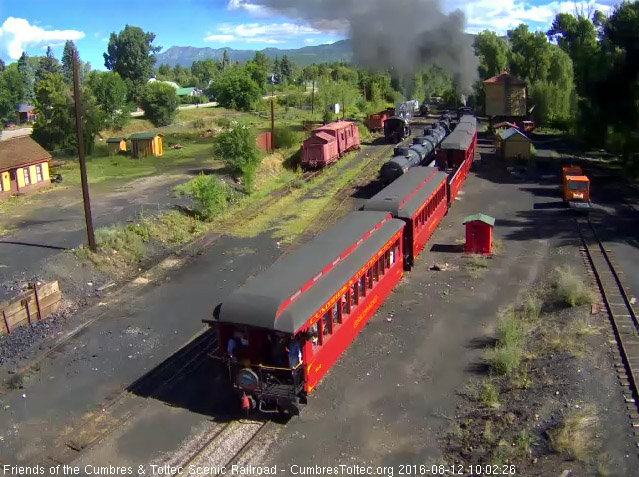 8.12.16 The conductor talks to passengers on the platform of the Colorado.jpg