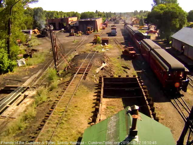 8.12.16 Parlor New Mexico is by the tipple as the trainman awaits the stop.jpg