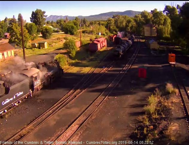 8.14.16 As the loader adds coal to the bunker, one of the hostlers washes the engine down.jpg