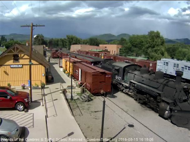 8.15.6 487 is by the depot with dark clouds on the horizon.jpg