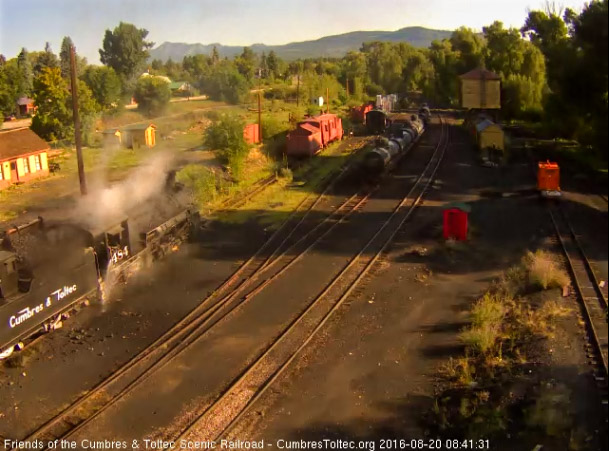 8.20.16 Coal is added to the bunker as one of the hostlers washes down the cab.jpg