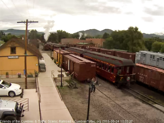 8.24.16 The conductor climbs aboard the Colorado as the photographer checks his shot.jpg