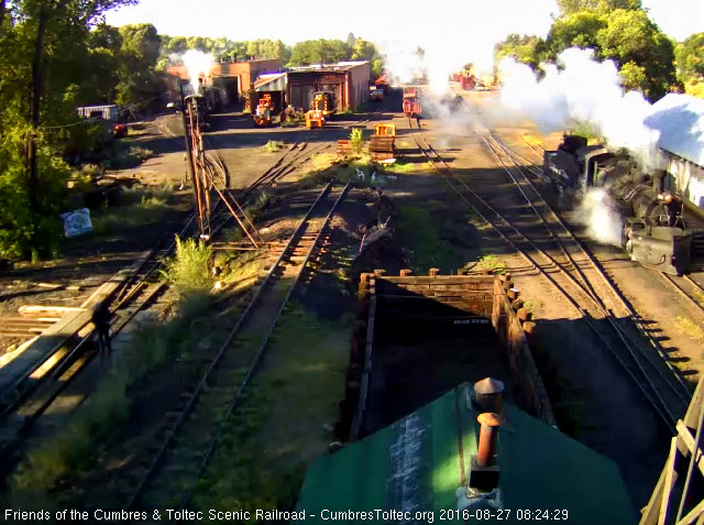 8.27.16 487 now pulls forward to the coal dock, lets no overlook the intrepid fellow spraying water on the pit.jpg