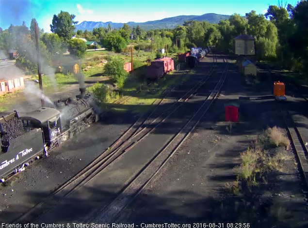 8.31.16 As one hostler adds coal to the 484's bunker the other one washes the cab off.jpg