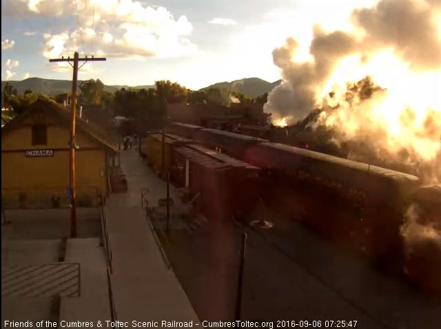 9.6.16 With the rising sun shining through the smoke, 484 brings the student freight out of south yard.jpg