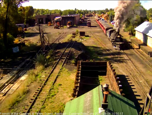 9.6.16 The 489 gets train 216 moving out of Chama as it passes the wood shop.jpg