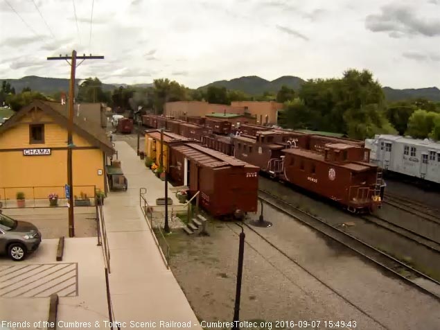 9.7.16 The conductor is on the steps of the caboose directing the move.jpg