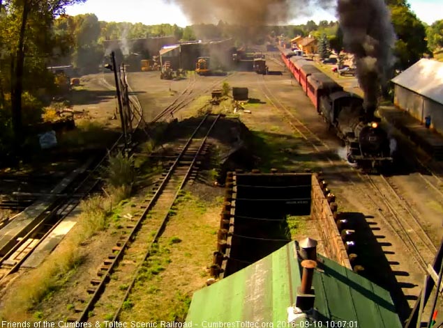 9.10.16 484 is putting out a nice plume of smoke as it passes the wood shop.jpg