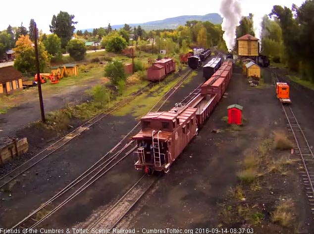 9.14.16 The student who is riding the caboose has joined the railroad staff on the platform.jpg