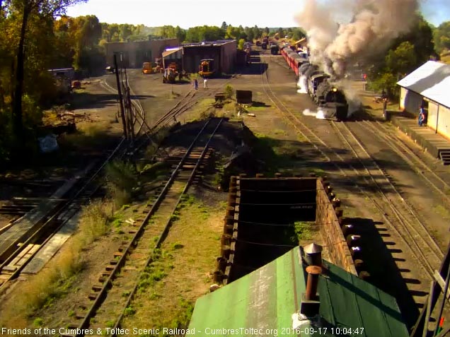 9.17.16 487 and 489 get train 216 moving as it passes an open wood shop.jpg