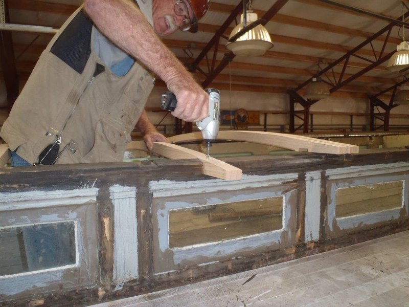 Craig McMullen screws a carlin(roof rafter) into place on  Cook Car 053.jpg