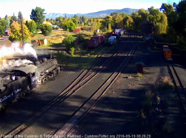 9.19.16 489 is being oiled around by the road crewman who starts early.jpg