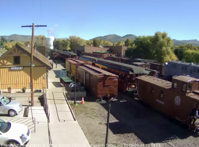 9.24.16 The conductor is climbing onto the caboose as the train starts to move.jpg