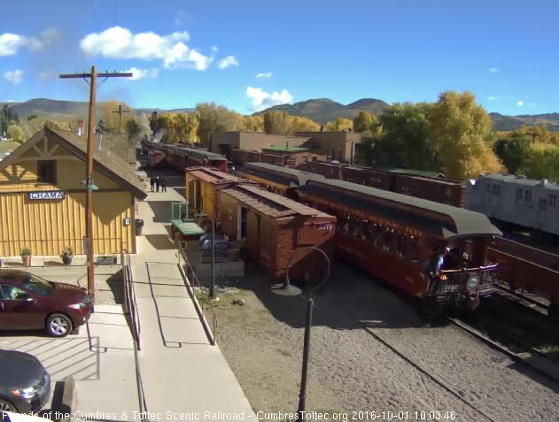 10.1.16 After giving the hi ball the conductor climbs onto the New Mexico.jpg