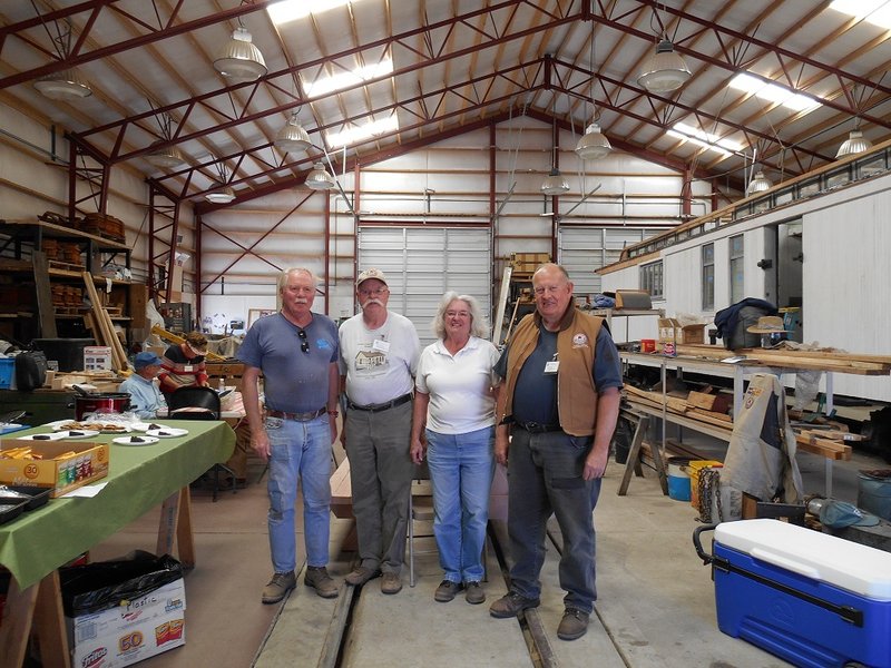 Jim McGee, Ed Lowrance and Sharon McGee receive their 15-year volunteer service pins from PC Chair John Engs.jpg