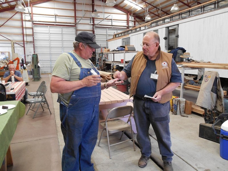 PC Chair John Engs presents Dan Pyzel with pin commemorating 25 years of volunteer service.jpg