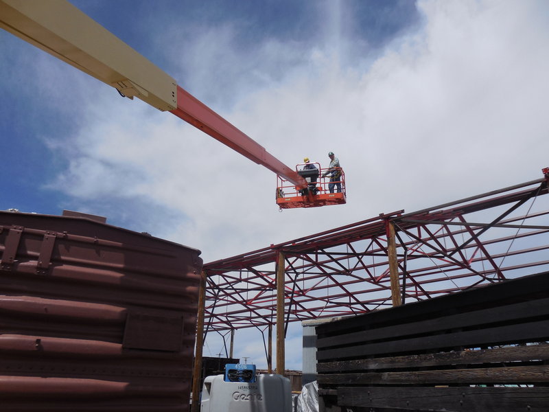 Russ Hanscom and Sam Hauck return to terra firma after lowering purlin.JPG