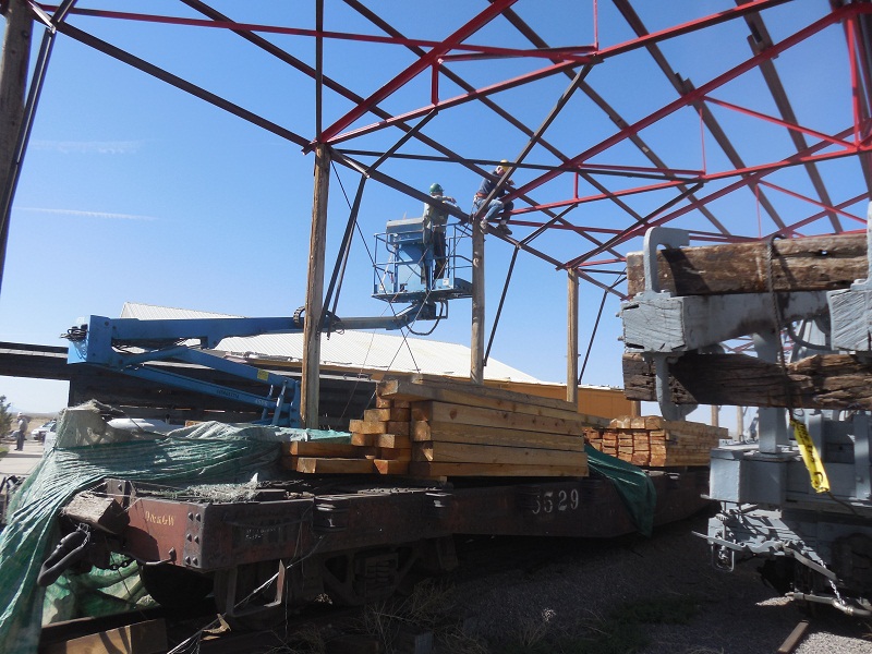 Car Shelter Team Leader Russ Hanscom installs bracing; team member Sam Hauck is in the man lift cage..jpg