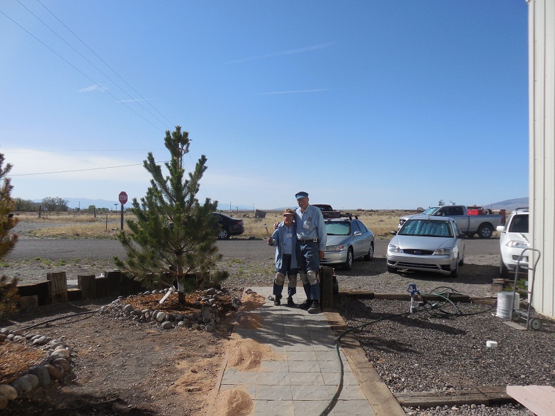 Naomi and Jim Sublett admire their handiwork on the new walkway outside the Car Restoration Facility in Antonito.jpg