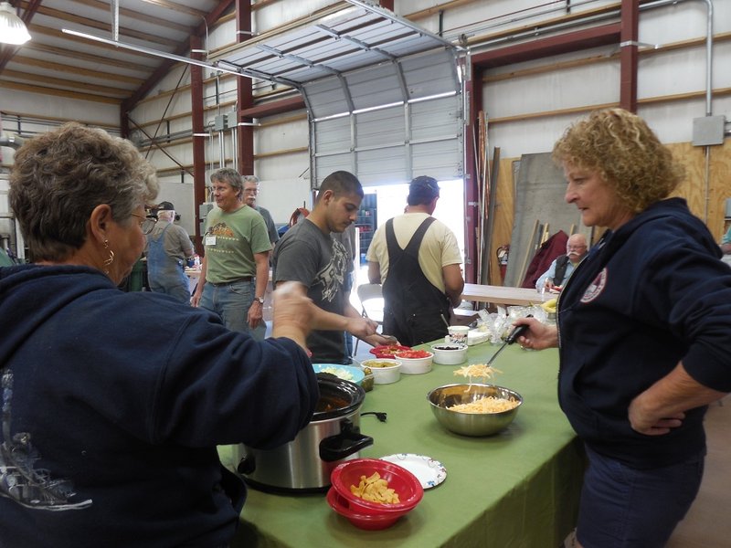 Food Service TL Patty Hanscom and Maggie McMullen serve Frito pie to volunteers and invited guests from the C&TSRR!.jpg