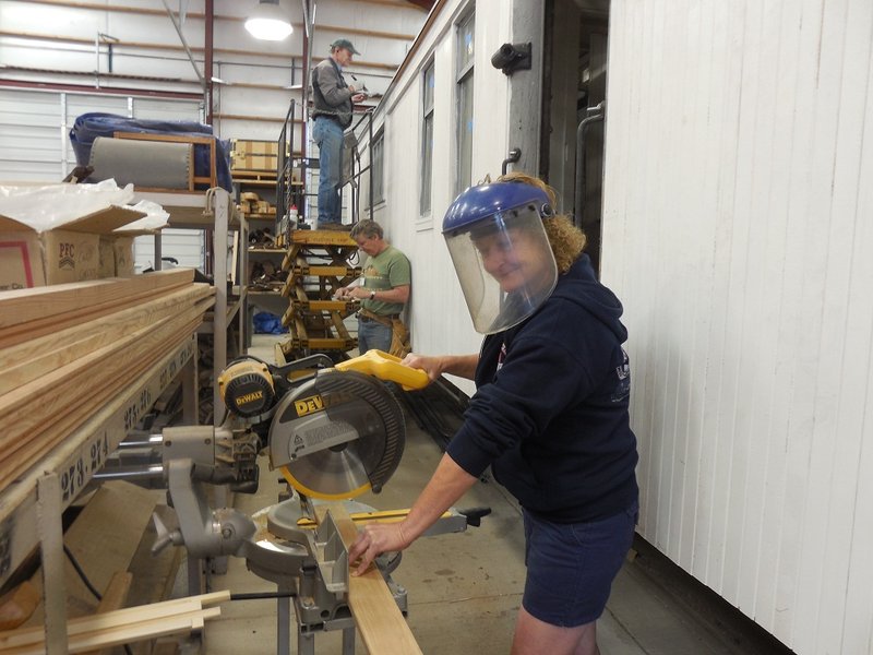 Maggie McMullen trims a board for the Cook Car 053 crew.jpg
