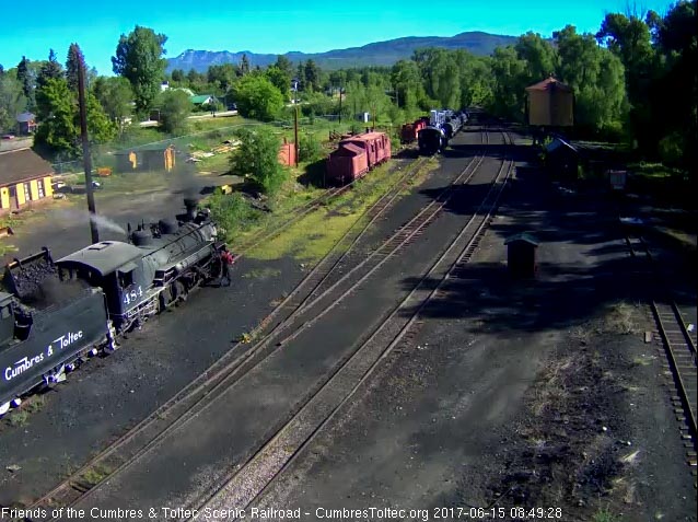 6-15-17 Coal is added to the bunker of 484 as one of the road crewmen oils around.jpg