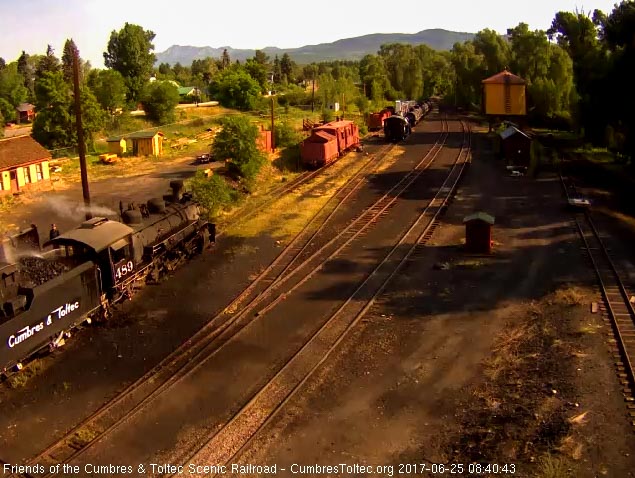 6-25-14 The road crewman, who always gets an early start, is spraying water on the coal as its added.jpg