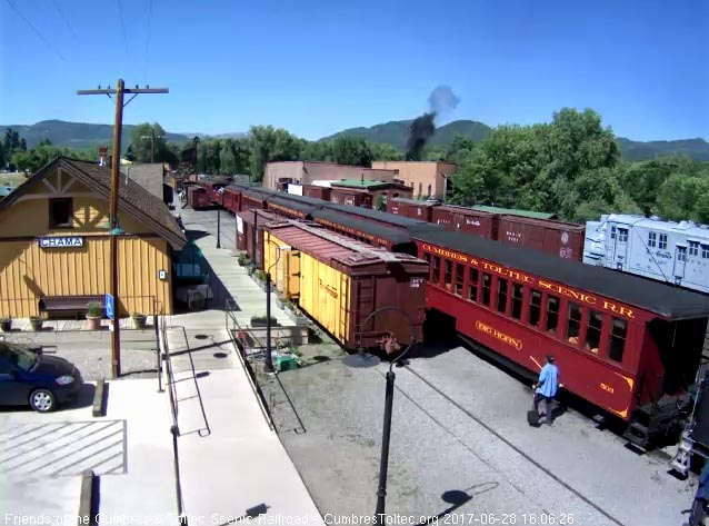 6-28-17 The train has stopped as we see a puff of black smoke from behind the house.jpg