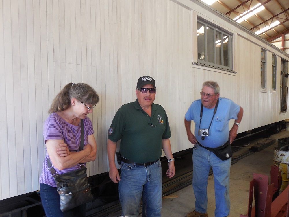 Board Member Maureen Gonzales, Friends' President Tim Tennant and Chronicler Tim Smith are briefed on the restoration of Cook Car 053 at the Antonito CRF..jpg