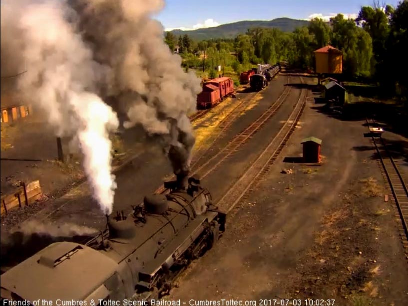 7-3-17 489 emerges from behind the tipple blowing for the running brake test.jpg