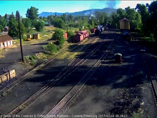 7-4-17 The 484 is doing such a long blow down the steam is rising above the trees.jpg