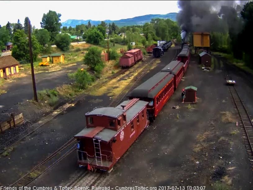 7-13-17 The conductor is on the platform of the caboose trailing this morning's train.jpg