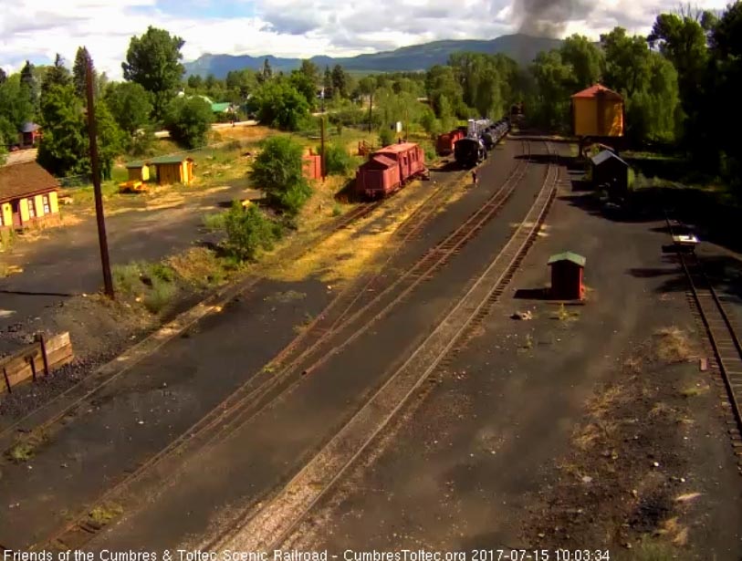 7-15-17 Smoke drifts over the trees as the last cars move out of sight.jpg