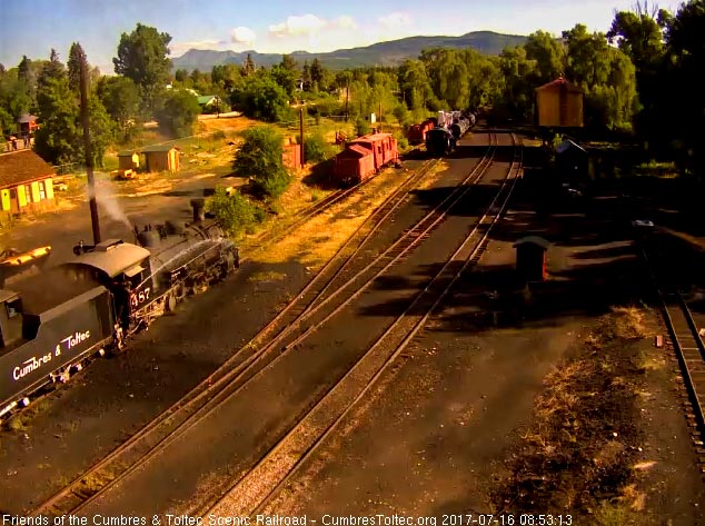 7-16-17 As the coal dust flies, the crew member who likes to start early is washing down the locomotive.jpg