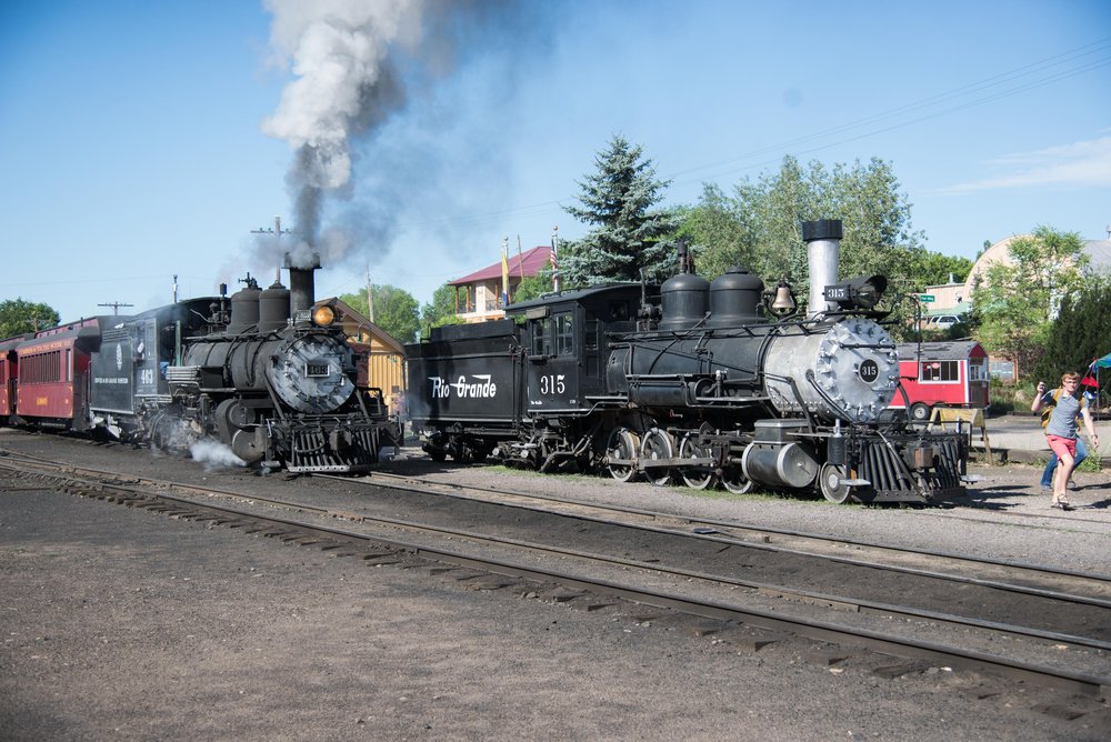 6 K27 463 is pulling the consist of train 216 forward into loading position with C18 315 in background.jpg