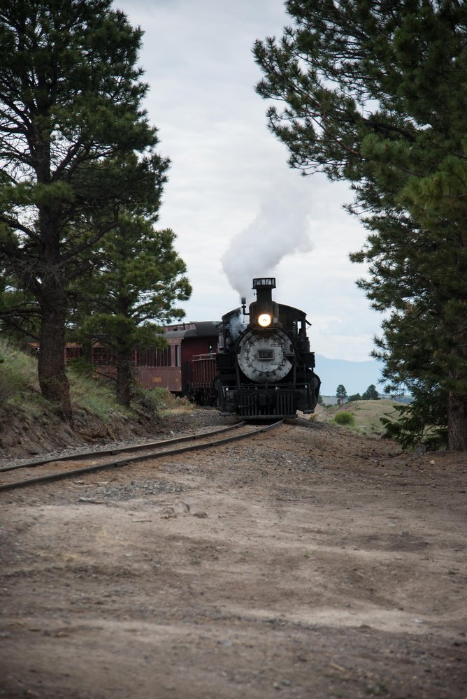 5 463 comes around the curve blowing for the Forest Service road down to the valley of the Los Pinos.jpg