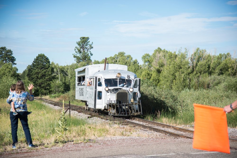 10 A happy fan waves to the goose and its passengers as the flagman does his job.jpg