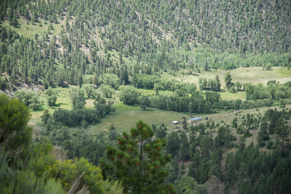 10 Looking down at an off grid summer home in the river valley.jpg