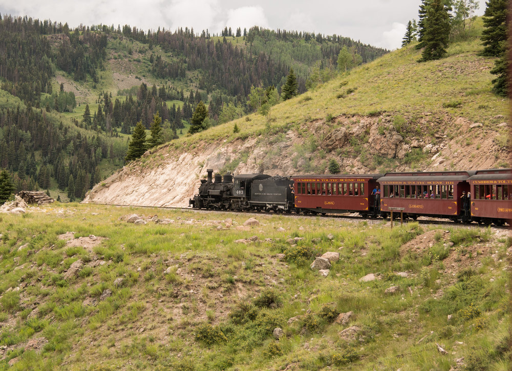 37 Out little train heads around the curve that will take up to the head of Los Pinos valley.jpg