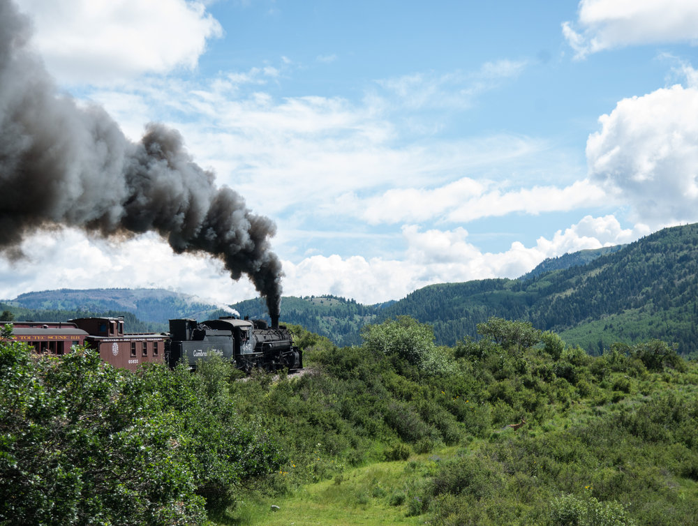 10 The 487 continues to work up the 4% grade with a caboose behind the locomotive.jpg