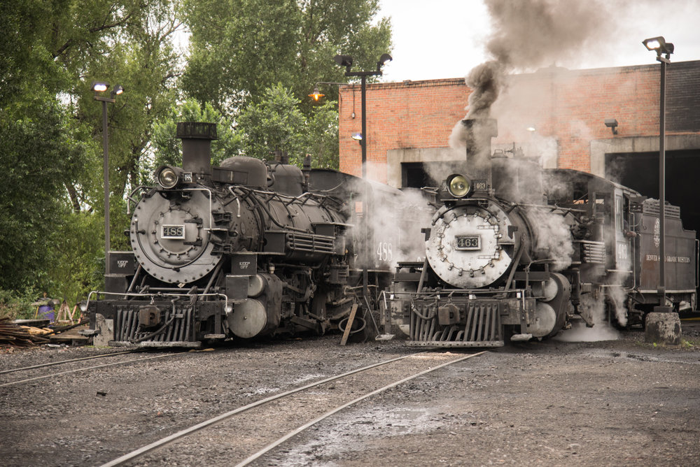 1 488 and 463 rest in front of the engine house in Chama.jpg