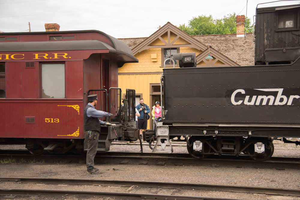13 The trainman guides the locomotive as it backs onto the train.jpg